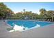 A luxurious swimming pool with clear water and lounge chairs, perfect for relaxation and recreation at 21 Morgan Place Dr, Isle of Palms, SC 29451