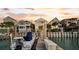 Stunning waterfront home with private boat dock, surrounded by beautifully designed residences and picturesque scenery at 21 Morgan Place Dr, Isle of Palms, SC 29451