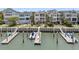 Aerial view of waterfront homes featuring private docks, lush landscaping, and breathtaking views of the coast at 21 Morgan Place Dr, Isle of Palms, SC 29451