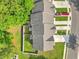 Aerial view of townhomes showing roof tops, fenced in yards, driveways, parked cars, and lawns at 210 Grand Palm Ln, Summerville, SC 29485
