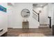 Basement entrance to carpeted stairs with white risers, accompanied by a decorative wall rack for wine bottles at 210 Grand Palm Ln, Summerville, SC 29485