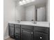 Bathroom features double sink vanity with modern fixtures and dark cabinets at 210 Grand Palm Ln, Summerville, SC 29485