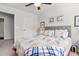 Comfortable bedroom featuring ceiling fan, nautical bedding, and a light colored carpet at 210 Grand Palm Ln, Summerville, SC 29485