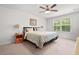 Bright primary bedroom with ceiling fan and large window at 210 Grand Palm Ln, Summerville, SC 29485