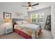 Bright bedroom with a ceiling fan, a large window, and coastal style decor at 210 Grand Palm Ln, Summerville, SC 29485