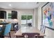 Dining area featuring a table set for four, with views of the backyard through sliding glass doors at 210 Grand Palm Ln, Summerville, SC 29485