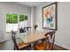 Charming dining area with a table set for four, complemented by a sliding glass door at 210 Grand Palm Ln, Summerville, SC 29485
