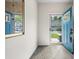 Bright entryway featuring wood-look floors, white walls, and a cheerful blue door at 210 Grand Palm Ln, Summerville, SC 29485