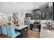 Modern kitchen featuring stainless steel appliances, granite countertops, and a breakfast bar at 210 Grand Palm Ln, Summerville, SC 29485