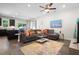 Open-concept living room and kitchen area with modern furniture, fixtures, and appliances at 210 Grand Palm Ln, Summerville, SC 29485