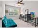 Bright and airy office space with two desks, a futon, and a large window at 210 Grand Palm Ln, Summerville, SC 29485