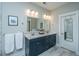 Stylish bathroom with double vanity, modern fixtures, and ample counter space at 2282 Braided Ln, Mount Pleasant, SC 29466