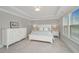 Bright and airy main bedroom with elegant furniture and a tray ceiling at 2282 Braided Ln, Mount Pleasant, SC 29466