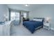 Inviting bedroom features a comfortable bed and a well-lit work space at 2282 Braided Ln, Mount Pleasant, SC 29466