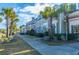 Charming clubhouse exterior with manicured landscaping and palm trees, perfect for gatherings and events at 2282 Braided Ln, Mount Pleasant, SC 29466