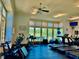 Bright fitness center featuring modern equipment, natural light, and motivational decor for a healthy lifestyle at 2282 Braided Ln, Mount Pleasant, SC 29466
