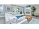 Comfortable living room showcasing a large sectional, fireplace, and sliding glass doors to the outdoor space at 2282 Braided Ln, Mount Pleasant, SC 29466
