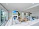 Open-concept living room featuring a fireplace, TV, comfortable seating, and seamless access to the dining area at 2282 Braided Ln, Mount Pleasant, SC 29466