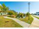 Landscaped walking trail by the pond with trees and community homes in the background at 2282 Braided Ln, Mount Pleasant, SC 29466
