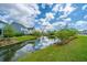 Water view of the pond with manicured landscaping at 2282 Braided Ln, Mount Pleasant, SC 29466