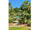 Beautiful community pool area featuring a slide, water feature, tropical plants, and lifeguard tower at 2282 Braided Ln, Mount Pleasant, SC 29466