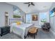 Bright bedroom featuring two windows, a ceiling fan, and tasteful decor at 2302 Hamlin Sound Cir, Mount Pleasant, SC 29466