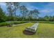 Community bocce ball court surrounded by lush lawns and landscaping providing a recreational amenity for residents at 2302 Hamlin Sound Cir, Mount Pleasant, SC 29466