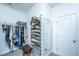 Small closet with shelves and hanging rack, perfect for organizing clothes and shoes at 2302 Hamlin Sound Cir, Mount Pleasant, SC 29466