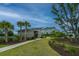 Stylish community center with modern wood facade, surrounded by lush landscaping and sidewalks under a blue sky at 2302 Hamlin Sound Cir, Mount Pleasant, SC 29466