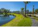 Scenic community with a lake, lush lawns, beautiful landscaping, and sidewalk trails for walking at 2302 Hamlin Sound Cir, Mount Pleasant, SC 29466