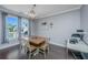 Elegant dining area featuring wood floors, natural light, and modern light fixtures at 2302 Hamlin Sound Cir, Mount Pleasant, SC 29466