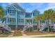 Charming light blue townhome with tropical landscaping and inviting front entrances at 2302 Hamlin Sound Cir, Mount Pleasant, SC 29466
