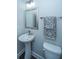 Modern half bathroom featuring a pedestal sink, stylish mirror and fixtures at 2302 Hamlin Sound Cir, Mount Pleasant, SC 29466