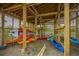 Community kayak storage rack with colorful kayaks and paddles, encouraging outdoor activities and community engagement at 2302 Hamlin Sound Cir, Mount Pleasant, SC 29466