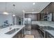Modern kitchen featuring stainless steel appliances and a large island with a sink at 2302 Hamlin Sound Cir, Mount Pleasant, SC 29466