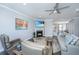Cozy living room featuring a fireplace, hardwood floors, and natural lighting at 2302 Hamlin Sound Cir, Mount Pleasant, SC 29466