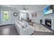 Bright living room with fireplace, comfortable seating, and a view of the outdoors at 2302 Hamlin Sound Cir, Mount Pleasant, SC 29466