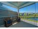 Cozy screened-in patio with comfortable seating, offering a peaceful outdoor retreat with water view at 2302 Hamlin Sound Cir, Mount Pleasant, SC 29466