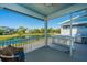 Serene screened-in patio overlooking a tranquil pond, perfect for relaxing and entertaining guests at 2302 Hamlin Sound Cir, Mount Pleasant, SC 29466
