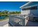 Inviting outdoor patio with grill overlooking the pond, ideal for entertaining or relaxing while enjoying waterfront views at 2302 Hamlin Sound Cir, Mount Pleasant, SC 29466