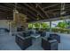 Community pavilion with a brick fireplace, ceiling fans, wood rafters, and cushioned outdoor seating at 2302 Hamlin Sound Cir, Mount Pleasant, SC 29466