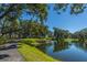 Scenic view of lakefront path with beautiful trees, offering a serene escape for nature lovers at 2302 Hamlin Sound Cir, Mount Pleasant, SC 29466
