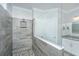 Walk-in shower with gray tiles, glass partition, and built-in shower head and shelf at 2302 Hamlin Sound Cir, Mount Pleasant, SC 29466
