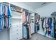 Organized walk-in closet with shelving and hanging rods for clothes and accessories at 2302 Hamlin Sound Cir, Mount Pleasant, SC 29466