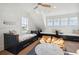 Bright bedroom features three built in beds, with a ceiling fan, and cozy beanbag chairs at 2568 Helmsman Rd, Johns Island, SC 29455