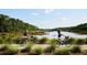 Scenic bike path featuring lush greenery and waterfront views at 2568 Helmsman Rd, Johns Island, SC 29455