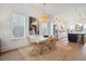 Open concept dining area featuring a modern light fixture and view to the kitchen at 2568 Helmsman Rd, Johns Island, SC 29455