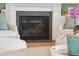 Cozy fireplace with stone surround flanked by armchairs, offering a relaxing ambiance at 2568 Helmsman Rd, Johns Island, SC 29455