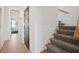 Hallway with wood floors and carpeted stairs, leading to various rooms in the home at 2568 Helmsman Rd, Johns Island, SC 29455