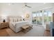 Serene main bedroom with a king bed, ceiling fan, and sliding glass doors to the outdoors at 2568 Helmsman Rd, Johns Island, SC 29455